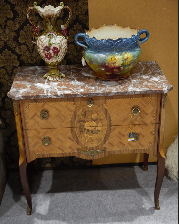 Direct front view of a vintage French Transition style wooden two-drawer commode featuring fine floral marquetry inlay, gilt bronze hardware, and a red veined marble top