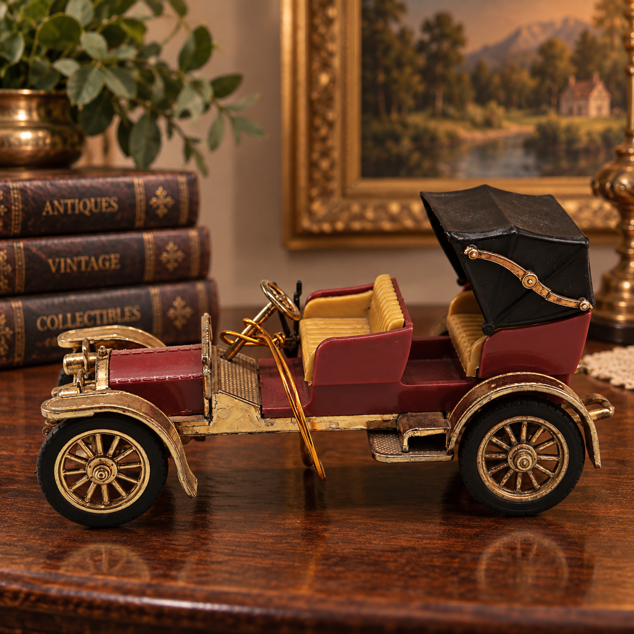 Vintage Gama Germany 1:43 scale diecast model of a 1902 Mercedes Simplex classic car, featuring a maroon body, tan seats, black folding canopy roof, and bright gold fenders and wheels.