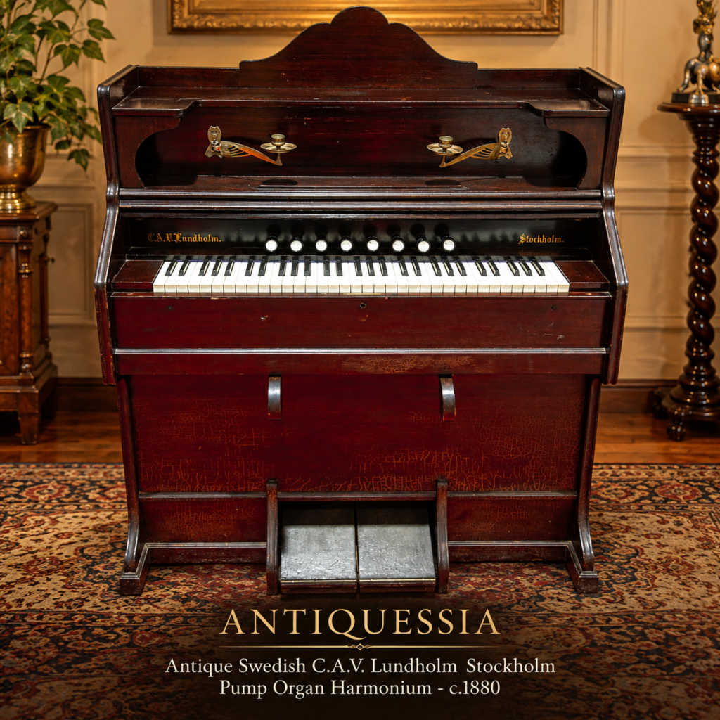 Antique Swedish upright pump organ made of rich dark wood by C.A.V. Lundholm Stockholm, featuring integrated brass candle holders, white ivory-style keys, and dual foot bellows pedals.