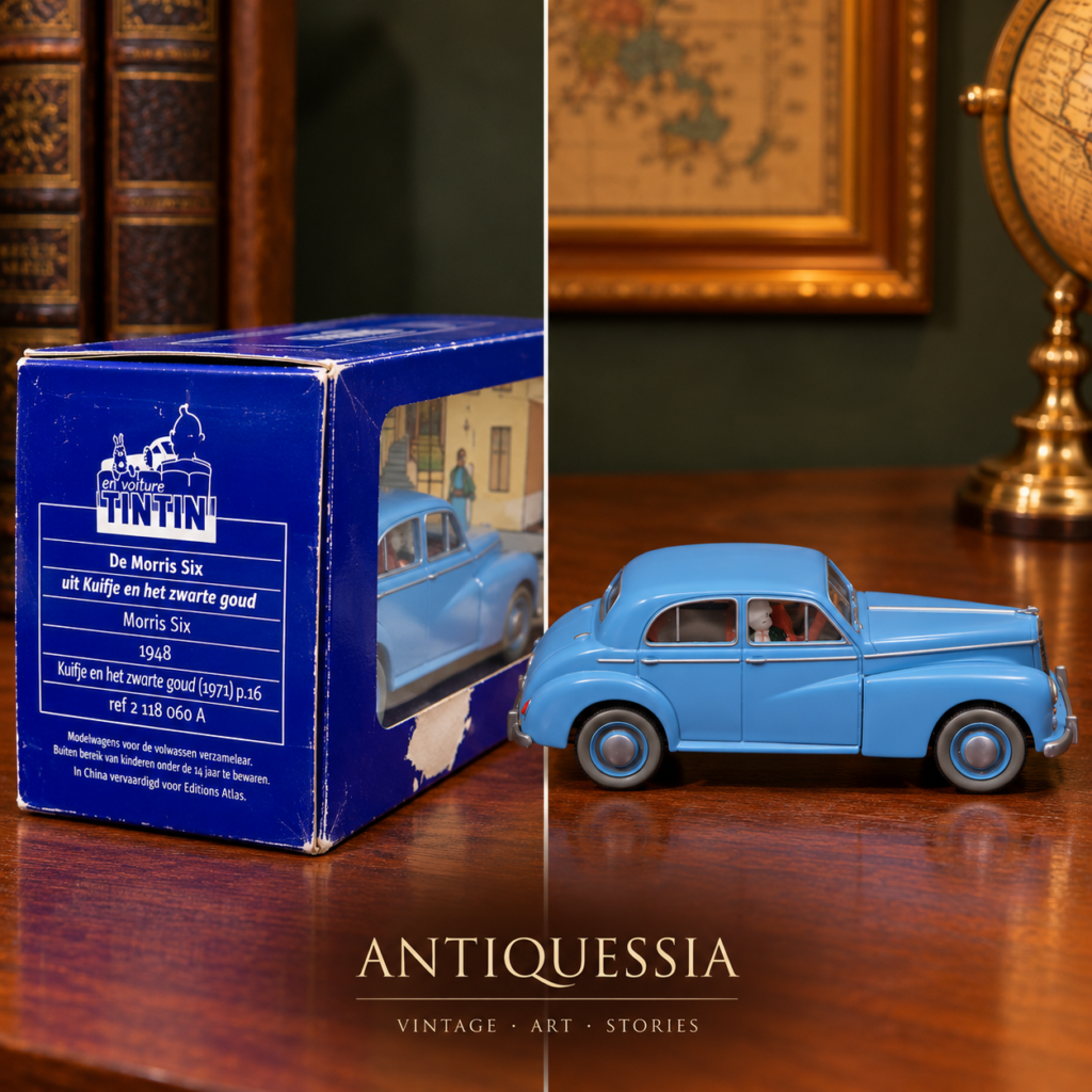 Vintage En Voiture Tintin die-cast light blue 1948 Morris Six saloon car featuring the Sheik's guards figurines inside its original blue and clear showcase box.