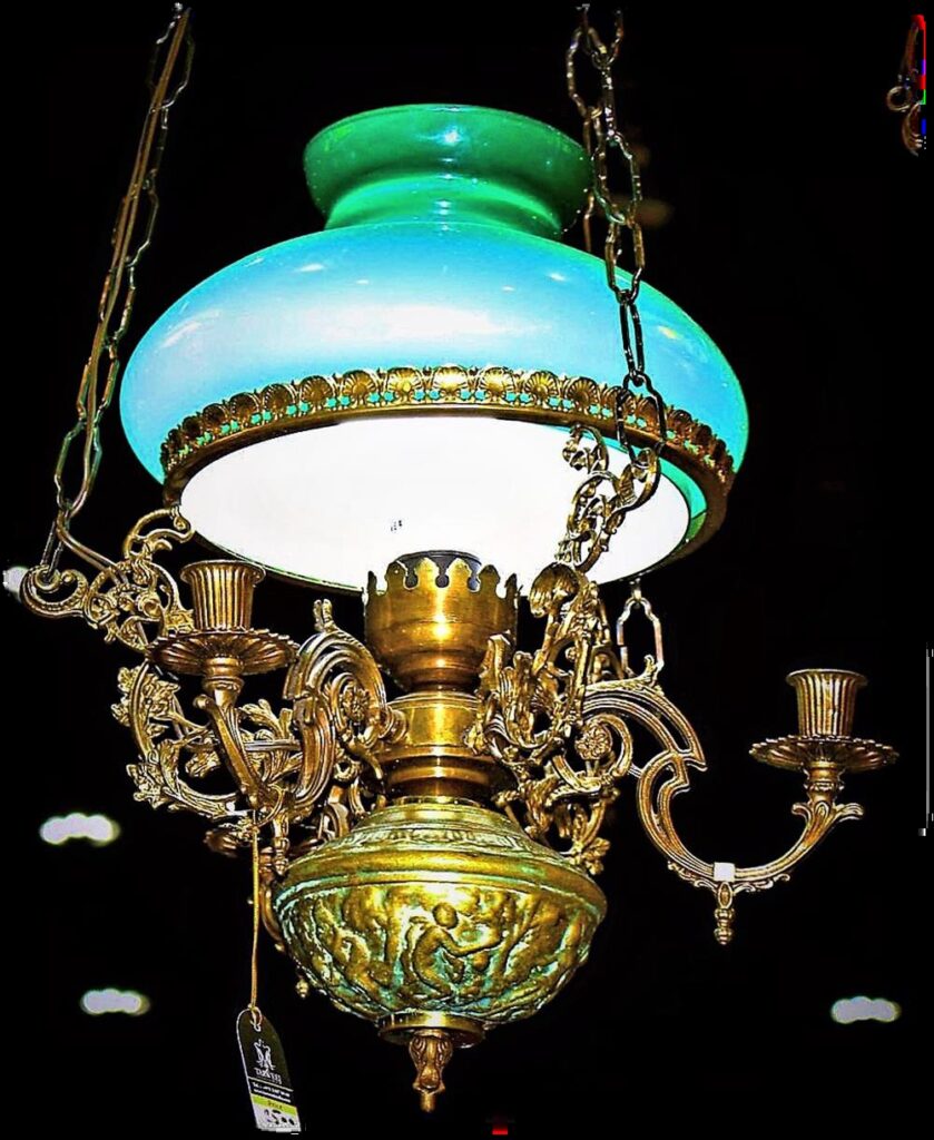 Antique French hanging library oil lamp chandelier made of ornate cast bronze and brass with classical relief details, featuring a turquoise green opaline glass dome shade, late 19th-century Victorian Napoleon III style.