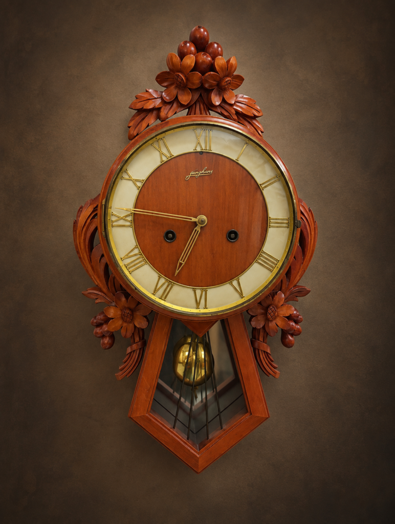 Antique German Junghans hand-carved wooden mechanical wall clock with Roman numeral dial, decorative leaded glass and brass pendulum, c. 1920s.