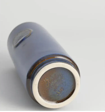 A high-end vintage Scandinavian art pottery cylinder vase showcasing a rich luminous blue and brown glaze technique that creates an aurora effect, carrying the official artist mark on the base.