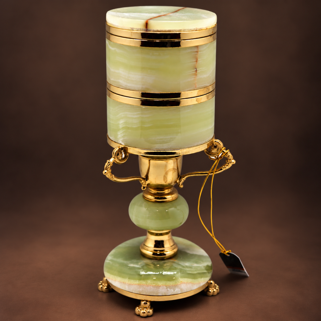 Vintage 1950s Italian green onyx mechanical cigarette dispenser with polished brass bands, ornate side handles, cylindrical compartment, and matching green onyx pedestal base.