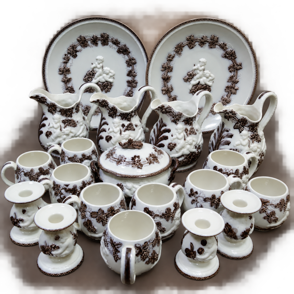 Vintage Gefle Mullbär Swedish 20-piece ceramic service set featuring ivory-white glazed pitchers, cups, plates and covered bowl decorated with raised cherubs and dark brown grapevine motifs.