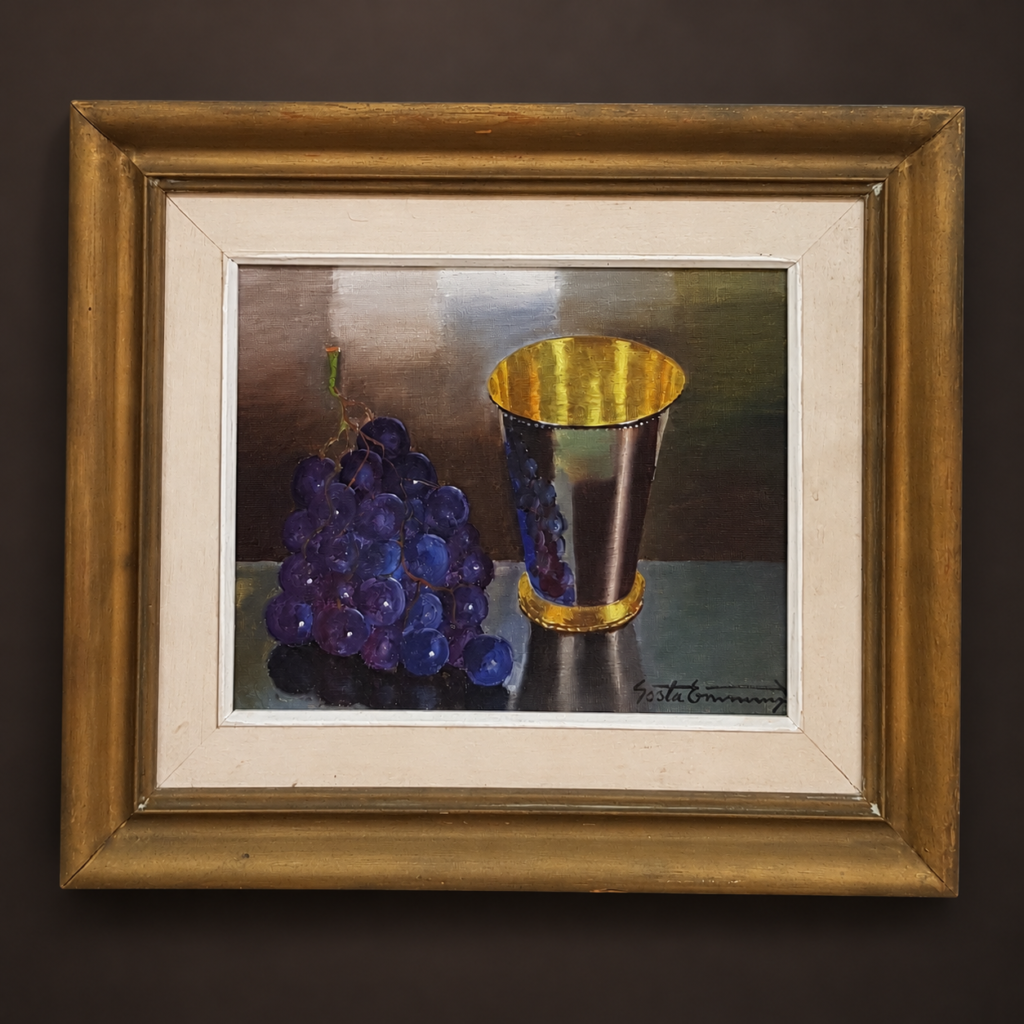 Vintage Swedish still-life oil painting, signed Gösta Emming, featuring purple grapes and a silver cup with a gold interior, set in a gold-and-cream wooden frame.
